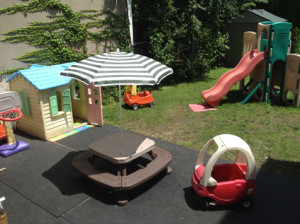First Tiny steps day care in Astoria offers a safe back yard play area